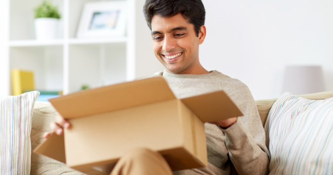 customer opening a breakthrough touchpoint gift